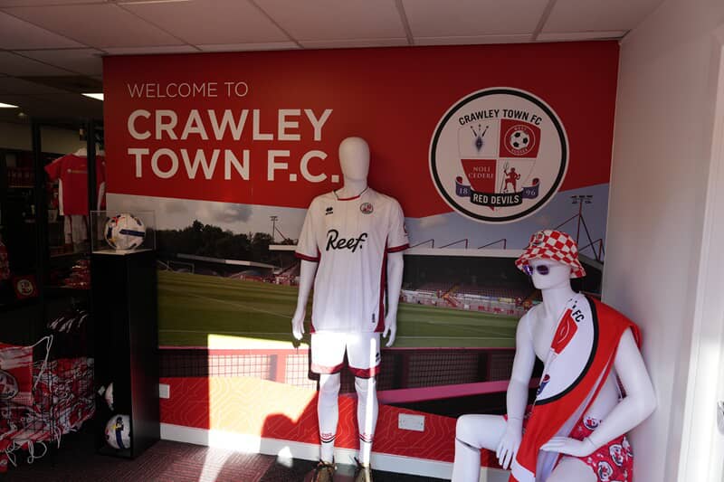 An image of the interior decor and signage for the Crawley Town Football Club.